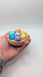 Dumpling Clicker Fidget Toy in Steamer Basket