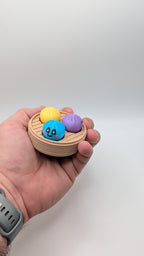 Dumpling Clicker Fidget Toy in Steamer Basket